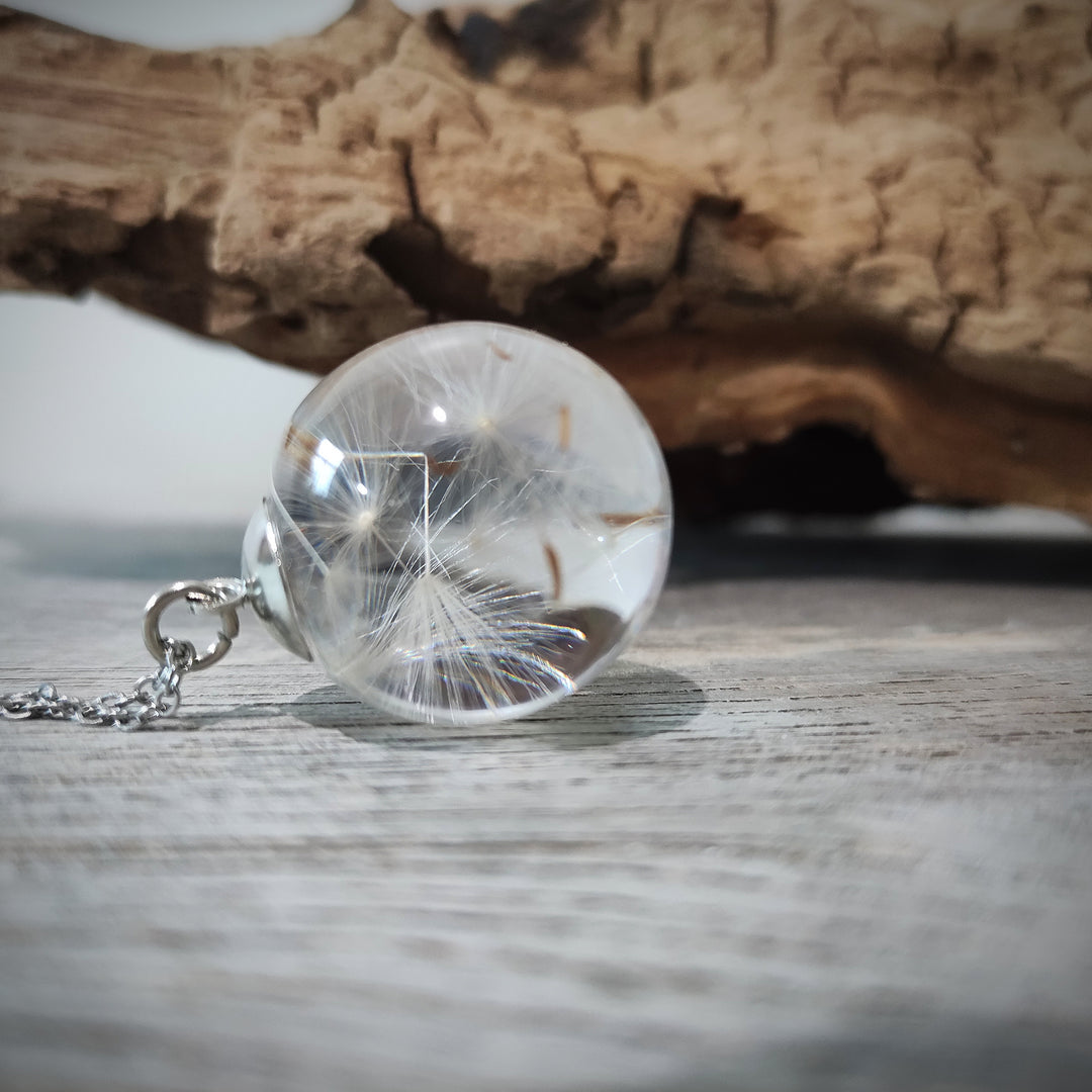 Long silver chain with dandelion seeds in a sphere