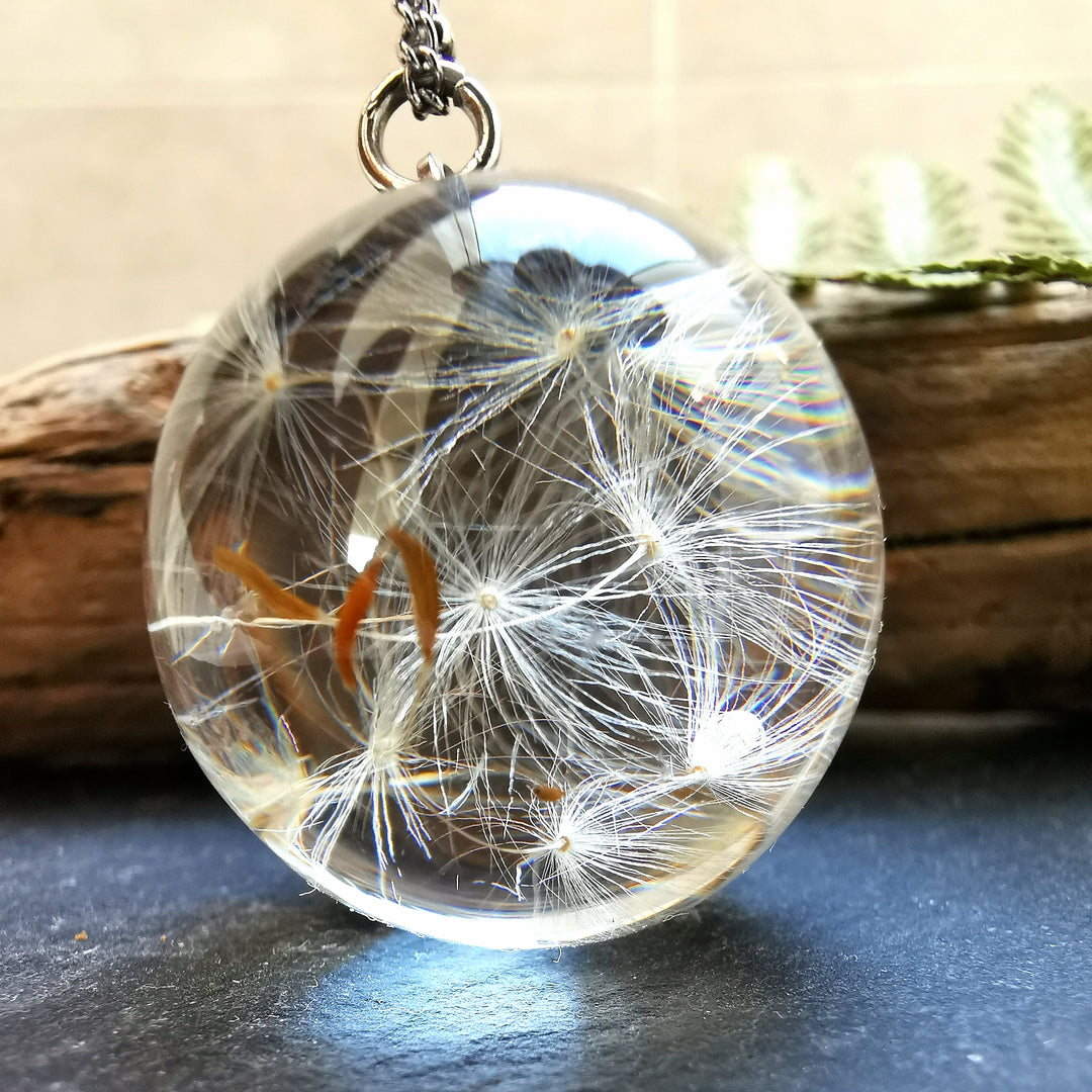 Long silver chain with dandelion seeds in a sphere